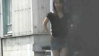 Young sexy Jap lady pooping outdoor