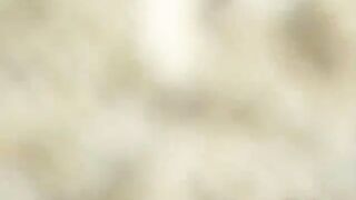 Young lady pooping heavily on the foot path