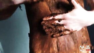 Lovely girl smearing shit on her boobies