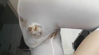 Blonde girl shits in her tights