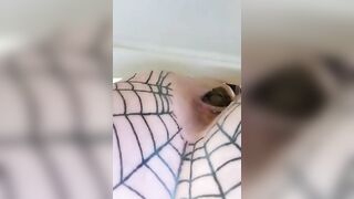 Girl spreads her ass in a fishnet stocking