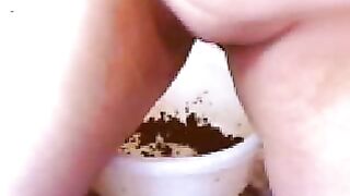Shitting in a bowl for smearing it on boobs