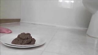 Brunette hot babe shitting in a white plate