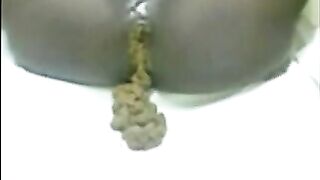 Ebony milf open wide legs for shitting on a chair