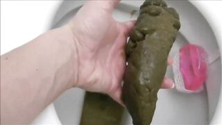 Girl shitting hard turd in the toilet