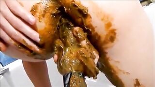 Lovely babe smear shit on butt and cunt masturbating with dildo