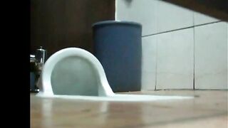 Caught her pissing in the public toilet