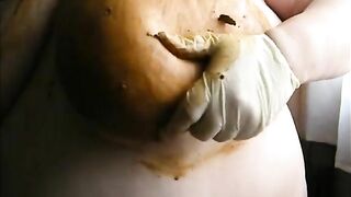 Woman squeezes out a big shit with her ass