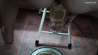 Girl takes a huge shit in a bowl on the floor