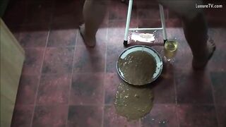 Girl takes a huge shit in a bowl on the floor