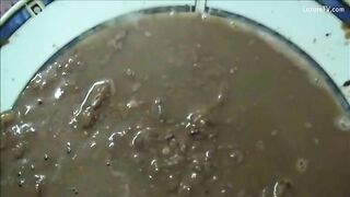 Girl takes a huge shit in a bowl on the floor