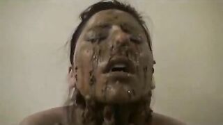 Cheeky girl rubs her pretty face with shit