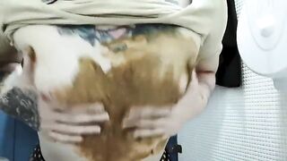 Cute blonde girl smearing shit on her tits