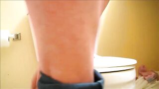 Straining out a huge shit in toilet