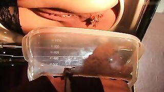 Lady in stockings pooping from the chair