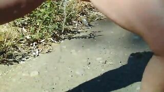 Naked girl pooping on the stones