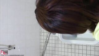Nasty brunette gal pooping in toilet