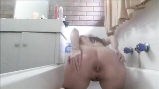Cute looking blonde babe masturbates in the toilet