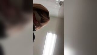Nerdy lady in glasses and face mask pooping closeup