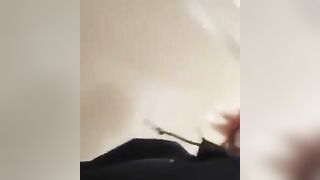 Nerdy lady in glasses and face mask pooping closeup