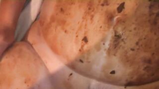 Slut rubs shit all over her tits and stomach