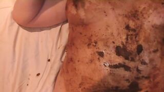 Slut rubs shit all over her tits and stomach