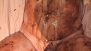 Slut rubs shit all over her tits and stomach