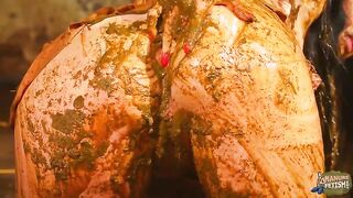 Pretty brunette chick playing with her pussy in manure