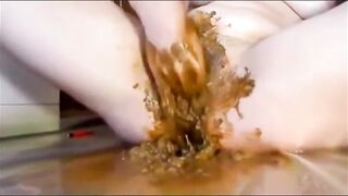 Girl masturbating and fisting pussy with shit