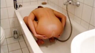 Girl shitting in the bathtub